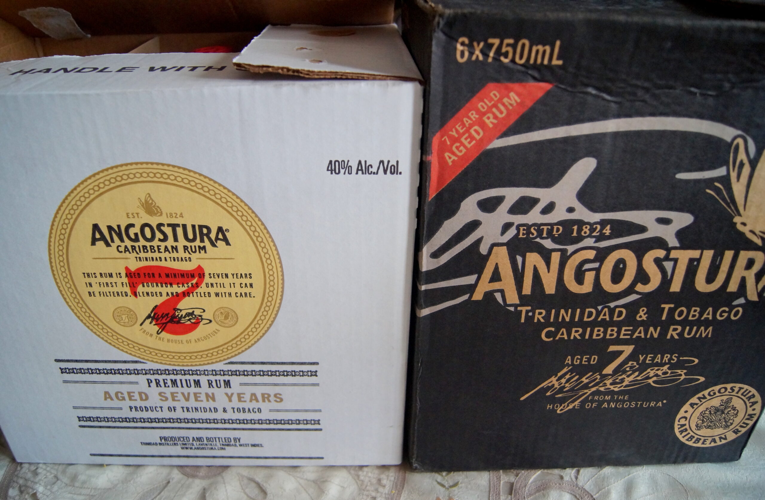 The new case and the older case for Angostura 7 Year Old Rum